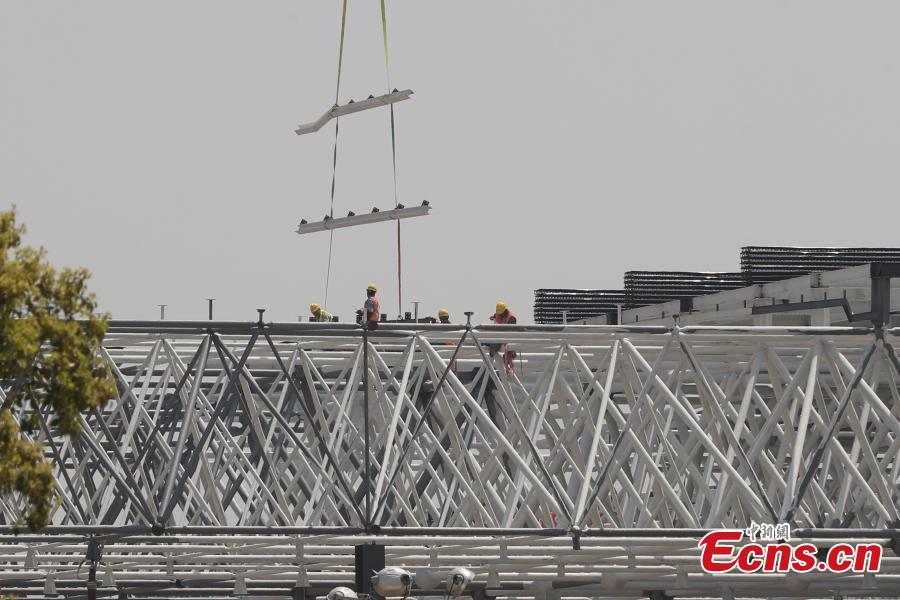Construction of Tesla\'s Shanghai Gigafactory 3 is in full swing, April 8, 2019. Several sets of steel structural roof frames have been installed. The new plant, Tesla\'s first outside the United States, is located in Lingang Area, a high-end manufacturing park in the southeast harbor of Shanghai. It is designed to have an annual capacity to create 500,000 electric cars. (Photo: China News Service/Zhang Hengwei)