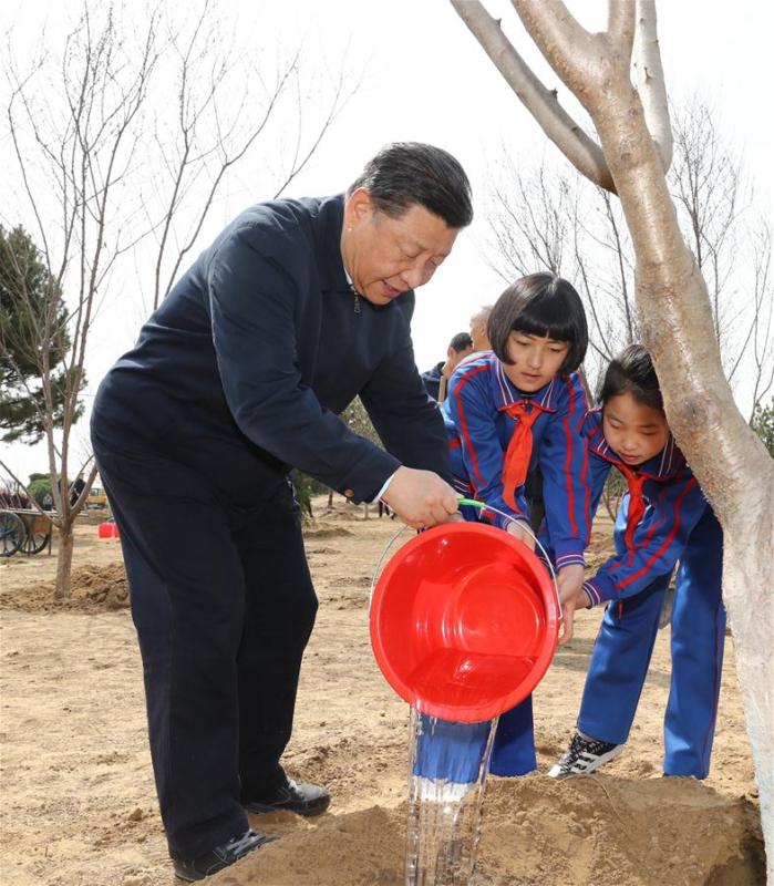 Chinese President Xi Jinping, also general secretary of the Communist Party of China Central Committee and chairman of the Central Military Commission, waters a sapling with school children as he attends a tree-planting activity in Tongzhou District in Beijing, capital of China, April 8, 2019. Other Party and state leaders, including Li Zhanshu, Wang Yang, Wang Huning, Zhao Leji, Han Zheng and Wang Qishan, also attended the activity. (Xinhua/Ju Peng)