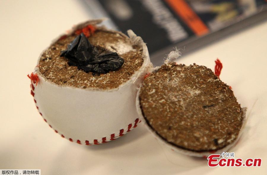 Confiscated drugs hidden inside a baseball are pictured during the annual media conference of the main customs office at the airport in Frankfurt am Main, western Germany, on April 8, 2019.  (Photo/Agencies)