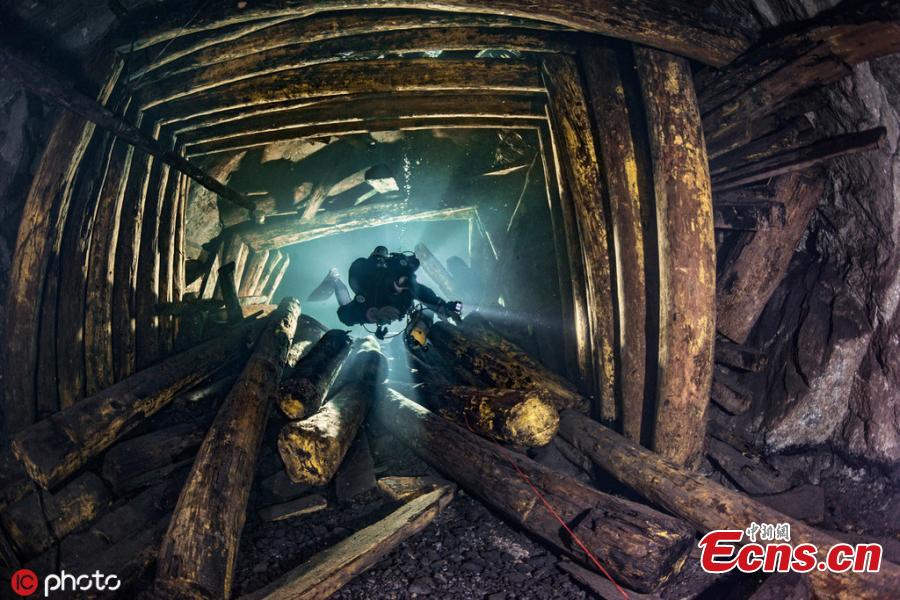 Photographer Martin Strmiska dived the Slovak Opal Mines, which has many tunnels, shafts and adits excavated in the volcanic hills. Five lowest levels are flooded, offering an incredible experience when diving in completely crystal clear water.(Photo/IC)