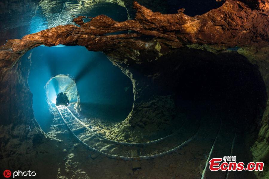 Photographer Martin Strmiska dived the Slovak Opal Mines, which has many tunnels, shafts and adits excavated in the volcanic hills. Five lowest levels are flooded, offering an incredible experience when diving in completely crystal clear water.(Photo/IC)