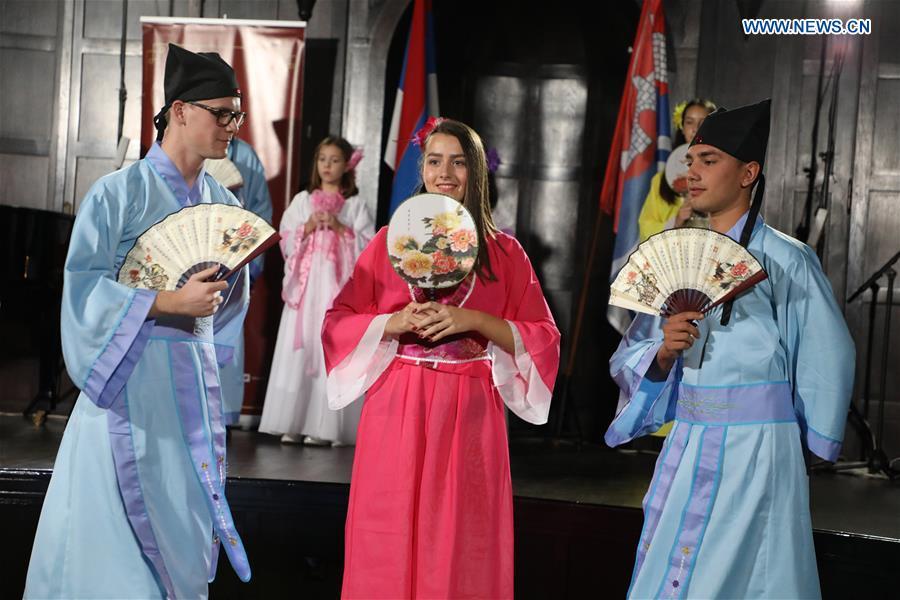 Students of the Confucius Institute of Banja Luka University dance in Chinese traditional costumes in Banja Luka, Bosnia and Herzegovina, on Sept. 22, 2018. The Confucius Institute of Banja Luka University organized a series of interactive workshops on the occasion of the Day of Confucius Institutes through a diverse program of activities in promoting Chinese culture on Saturday. (Xinhua/Haris Memija)