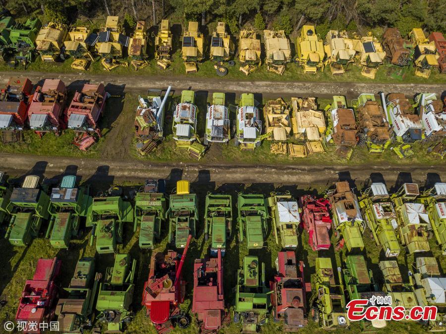 350 dead combines sit in a field, are broken for parts and exported around the world in a container, where they are welded back together on arrival. April 6 2019. (Photo/VCG)