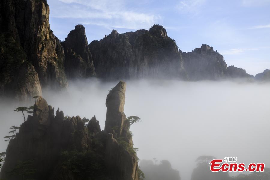 After rain, clouds surround the Xihai Grand Canyon, a sight-seeing spot on Mount Huang in Anhui Province, April 11, 2019. The mountain is a UNESCO World Heritage site, and one of China\'s major tourist destinations. (Photo: China News Service/Ye Yongqing)