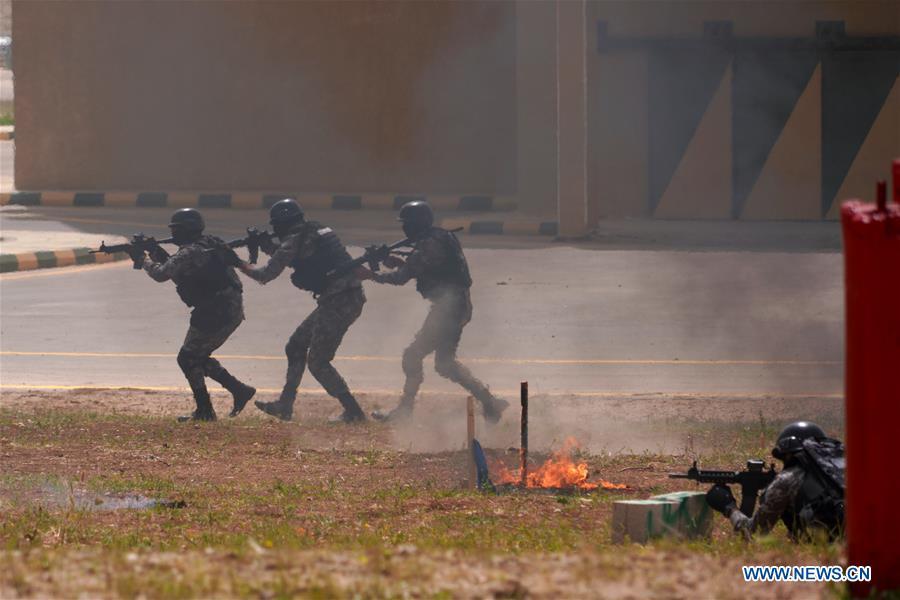 Soldiers of the Jordan Armed Forces (JAF) perform an anti-terror drill on the opening ceremony of the 11th annual Warrior Competition at the King Abdullah II Special Operations Training Center (KASOTC) in Amman, Jordan, April 14, 2019. (Xinhua/Lin Xiaowei)