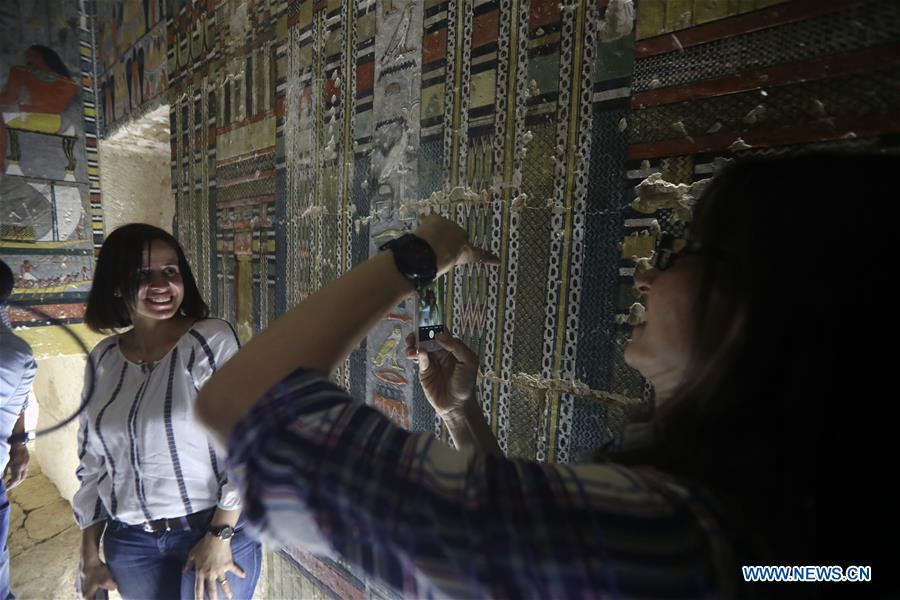 People visit a tomb in Saqqara, Egypt on April 13, 2019. Egyptian Ministry of Antiquities opened on Saturday a tomb of a Fifth Dynasty dignitary which was discovered recently at Saqqara Necropolis near the Giza pyramids. Minister of Antiquities Khaled al-Anany, along with 52 ambassadors and cultural attaches of foreign, Arab and African countries, toured Saqqara Necropolis to inspect the tomb of Khuwy, who lived at the end of the Fifth Dynasty of the Old Kingdom. The Old Kingdom of Egypt is the period spanning 2686 BC to 2181 BC, which is also known as the Age of the Pyramids. (Xinhua/Ahmed Gomaa)