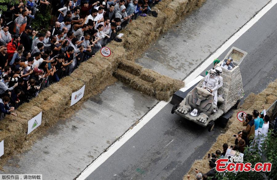 Competitors ride a homemade vehicle on a downhill track during the Red Bull Soapbox Race in Sao Paulo, Brazil, April 14, 2019. The Red Bull Soapbox race is an annual event where amateur drivers race their homemade soapbox vehicles down a hill through obstacles. (Photo/Agencies)