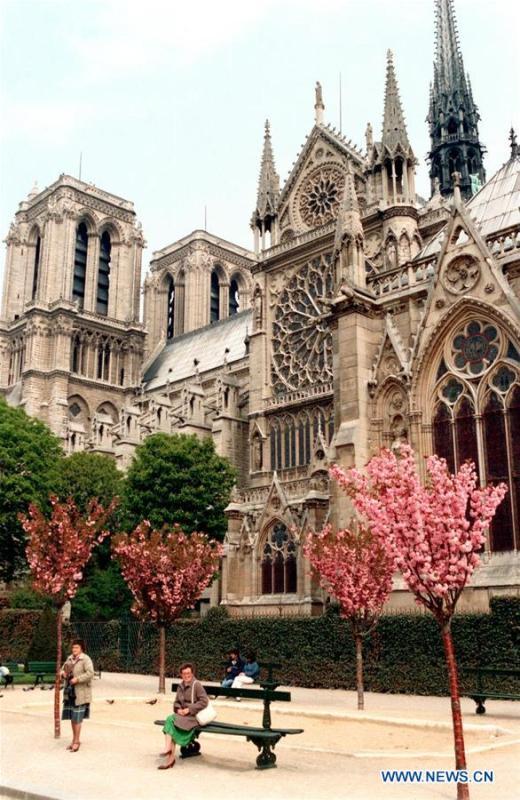 File photo taken in May of 1986 shows the Notre Dame Cathedral in Paris, France. The devastating fire at Notre Dame Cathedral in central Paris has been put out after burning for 15 hours, local media reported on April 16, 2019. In early evening on April 15, a fire broke out in the famed cathedral. Online footage showed thick smoke billowing from the top of the cathedral and huge flames between its two bell towers engulfing the spire and the entire roof which both collapsed later. Notre Dame is considered one of the finest examples of French Gothic architecture which receives about 12 million visitors every year. (Xinhua/Mu Qing)