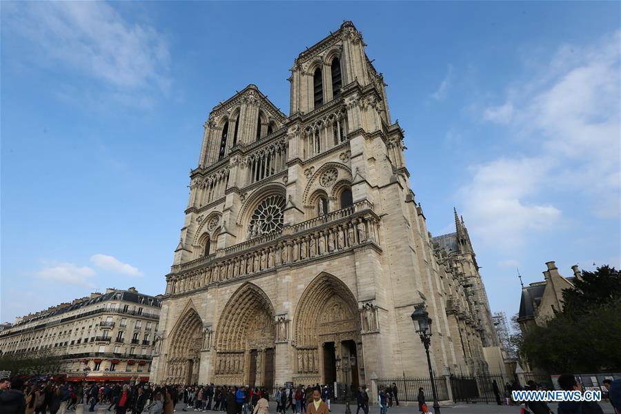 File photo taken on March 23, 2019 shows the exterior of the Notre Dame Cathedral in Paris, France. The devastating fire at Notre Dame Cathedral in central Paris has been put out after burning for 15 hours, local media reported on April 16, 2019. In early evening on April 15, a fire broke out in the famed cathedral. Online footage showed thick smoke billowing from the top of the cathedral and huge flames between its two bell towers engulfing the spire and the entire roof which both collapsed later. Notre Dame is considered one of the finest examples of French Gothic architecture which receives about 12 million visitors every year. (Xinhua/Zhang Cheng)