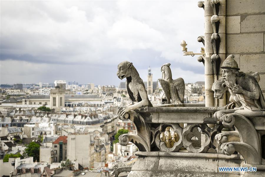 File photo taken on June 30, 2017 shows sculptures on the roof of the Notre Dame Cathedral in Paris, France. The devastating fire at Notre Dame Cathedral in central Paris has been put out after burning for 15 hours, local media reported on April 16, 2019. In early evening on April 15, a fire broke out in the famed cathedral. Online footage showed thick smoke billowing from the top of the cathedral and huge flames between its two bell towers engulfing the spire and the entire roof which both collapsed later. Notre Dame is considered one of the finest examples of French Gothic architecture which receives about 12 million visitors every year. (Xinhua/Chen Yichen)