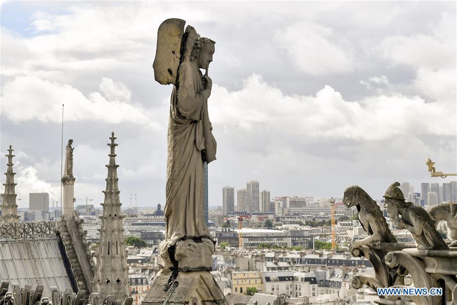 File photo taken on June 30, 2017 shows sculptures on the roof of the Notre Dame Cathedral in Paris, France. The devastating fire at Notre Dame Cathedral in central Paris has been put out after burning for 15 hours, local media reported on April 16, 2019. In early evening on April 15, a fire broke out in the famed cathedral. Online footage showed thick smoke billowing from the top of the cathedral and huge flames between its two bell towers engulfing the spire and the entire roof which both collapsed later. Notre Dame is considered one of the finest examples of French Gothic architecture which receives about 12 million visitors every year. (Xinhua/Chen Yichen)