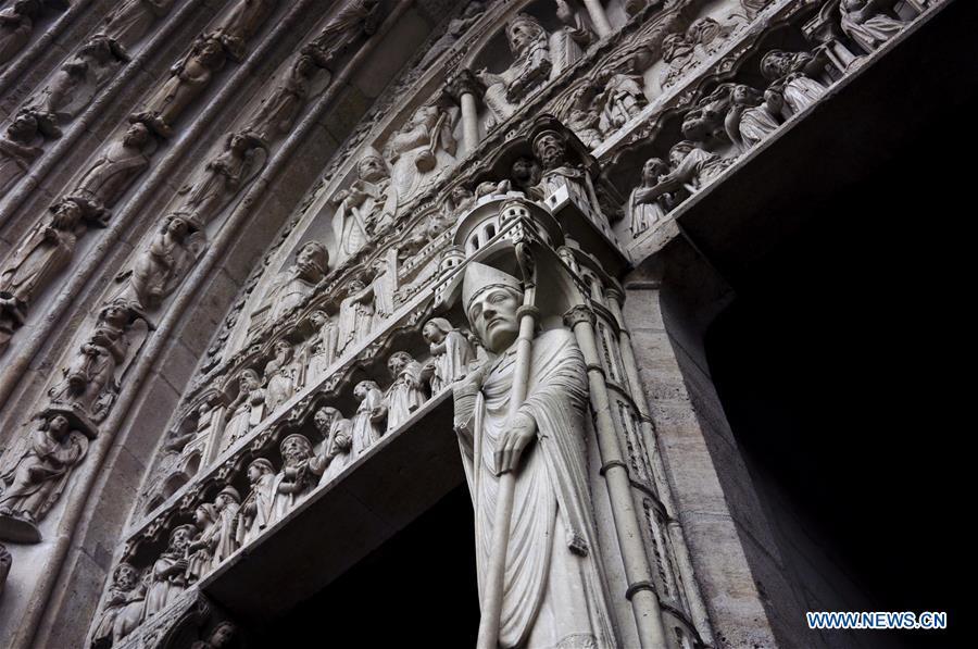 File photo taken on Oct. 11, 2013 shows exterior sculptures of the Notre Dame Cathedral in Paris, France. The devastating fire at Notre Dame Cathedral in central Paris has been put out after burning for 15 hours, local media reported on April 16, 2019. In early evening on April 15, a fire broke out in the famed cathedral. Online footage showed thick smoke billowing from the top of the cathedral and huge flames between its two bell towers engulfing the spire and the entire roof which both collapsed later. Notre Dame is considered one of the finest examples of French Gothic architecture which receives about 12 million visitors every year. (Xinhua/Liu Xiao)
