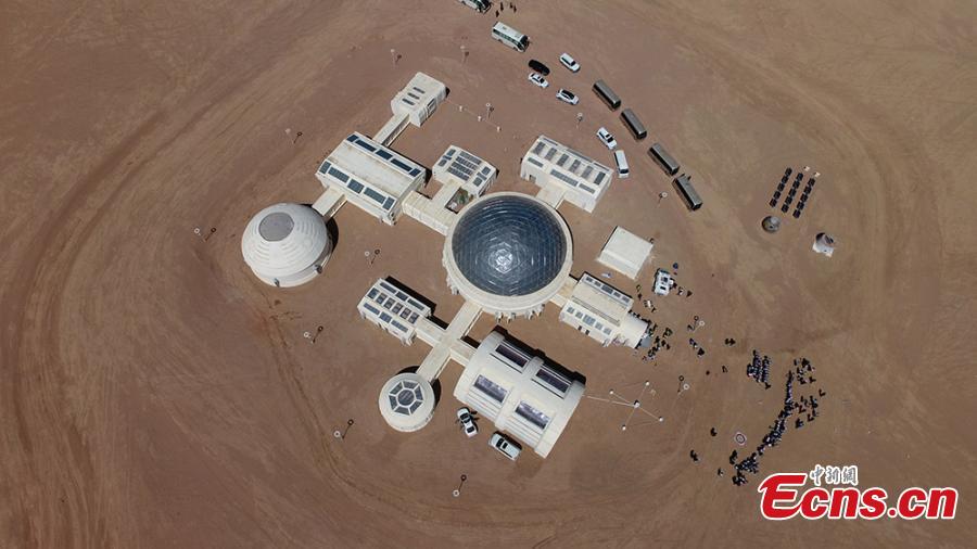 A picture taken with a drone shows an aerial view of the C-Space Project, a Mars simulation base in the Gobi Desert in Jinchang, Gansu Province, China, 16 April 2019. The C-Space Project Mars Base opened officially on 17 April 2019 with the aim to educate and provide an environment for youths and tourists to experience life on planet Mars. The base occupying an area of 11,996 square feet is situated about 40 kilometers from the town of Jinchang in the Gobi Desert. The location is chosen to simulate the landscape and harsh conditions of living on Mars as much as possible.  (Photo/China News Service)