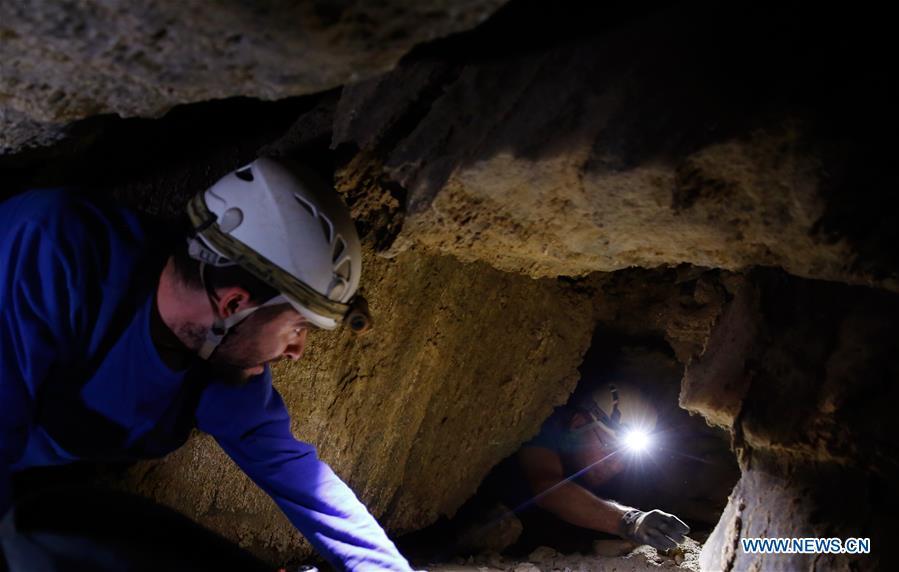 Cavers explore the Malham cave near the Dead Sea in southeastern Israel on April 14, 2019. Israeli and European researchers have discovered the world\'s deepest salt cave, Malham Cave with a depth of at least 10 kilometers, near the Dead Sea, said a report issued Thursday by the Hebrew University of Jerusalem. The researchers re-measured the 7,000-year-old Malham Cave, near the Dead Sea in southeastern Israel, and found that it is much longer than 5.5 kilometers as previously thought. Thus, the Israeli cave bypasses Iran\'s Cave of the Three Nudes (3N) on Qeshm Island, which since 2006 has been considered the world\'s deepest salt cave with a depth of 6.58 kilometers. (Xinhua/Gil Cohen Magen)