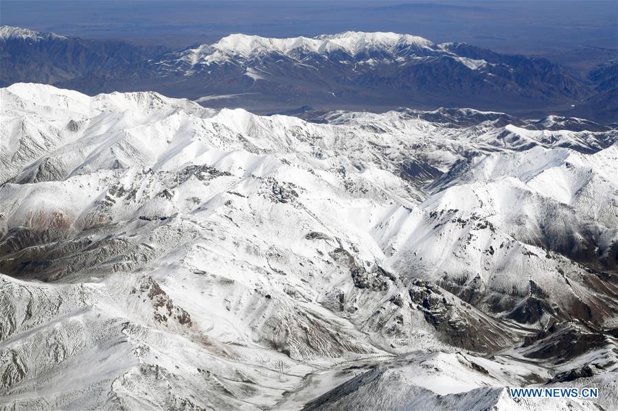 Aerial photo taken on April 21, 2019 shows the snow scenery of Qilian Mountains in northwest China. (Xinhua/Fan Peishen)