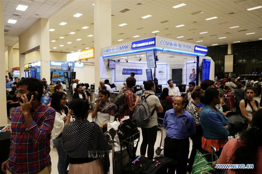 Passengers queue up for taxi at the Bandaranaike International Airport in Colombo, Sri Lanka, April 22, 2019. The death toll from the multiple blasts that ripped through Sri Lanka on Sunday rose to 228 while 450 others were injured, local media quoting hospital sources said. (Xinhua/Wang Shen)
