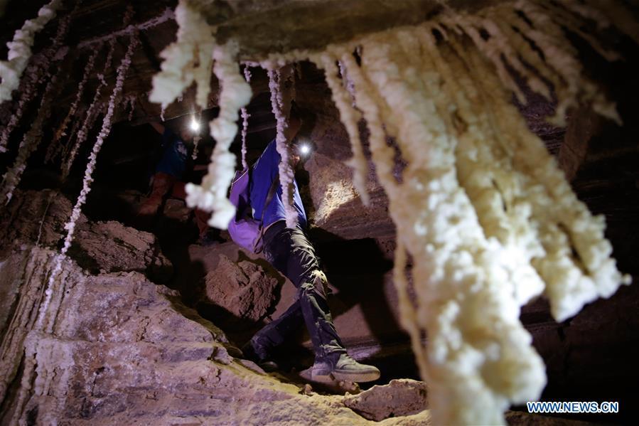 Cavers explore the Malham cave near the Dead Sea in southeastern Israel on April 14, 2019. Israeli and European researchers have discovered the world\'s deepest salt cave, Malham Cave with a depth of at least 10 kilometers, near the Dead Sea, said a report issued Thursday by the Hebrew University of Jerusalem. The researchers re-measured the 7,000-year-old Malham Cave, near the Dead Sea in southeastern Israel, and found that it is much longer than 5.5 kilometers as previously thought. Thus, the Israeli cave bypasses Iran\'s Cave of the Three Nudes (3N) on Qeshm Island, which since 2006 has been considered the world\'s deepest salt cave with a depth of 6.58 kilometers. (Xinhua/Gil Cohen Magen)