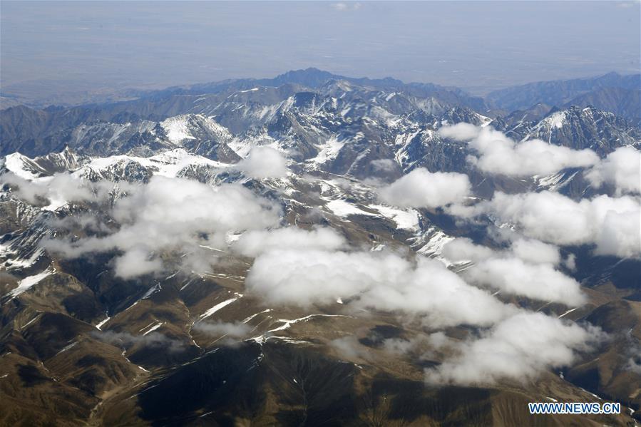Aerial photo taken on April 21, 2019 shows the snow scenery of Qilian Mountains in northwest China. (Xinhua/Fan Peishen)