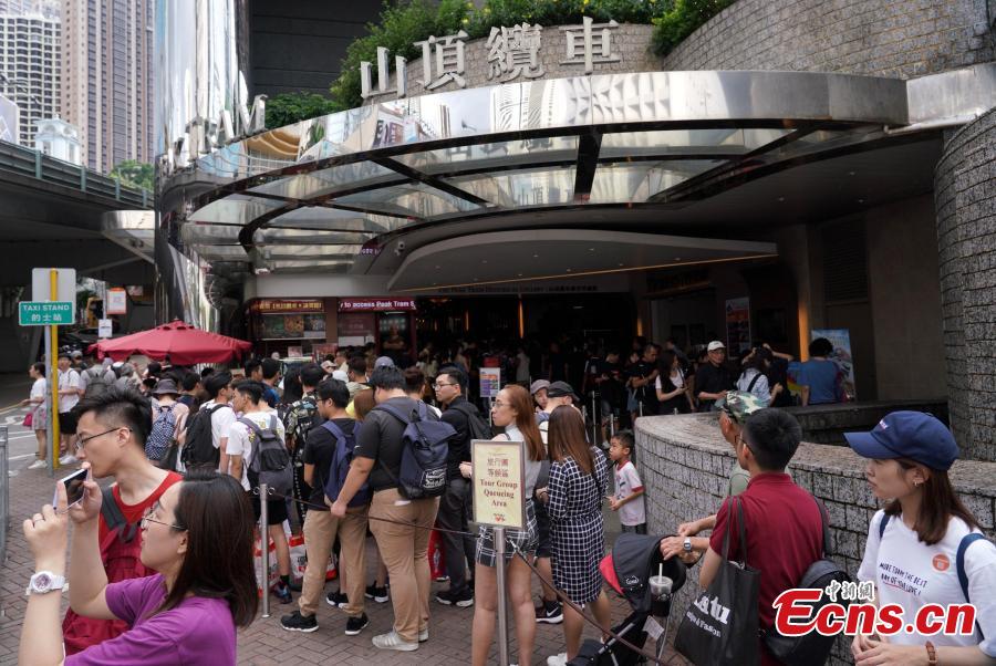 People wait to board the Peak Tram service in Hong Kong, April 22, 2019. A project to upgrade the tram will involve a significant investment of HK$684 million, replacing the current tram cars, which have a capacity of 120 passengers, with new 210-passenger tram cars. The first suspension of the Peak Tram service will begin on April 23 and last approximately two to three months. (Photo: China News Service/Zhang Wei)