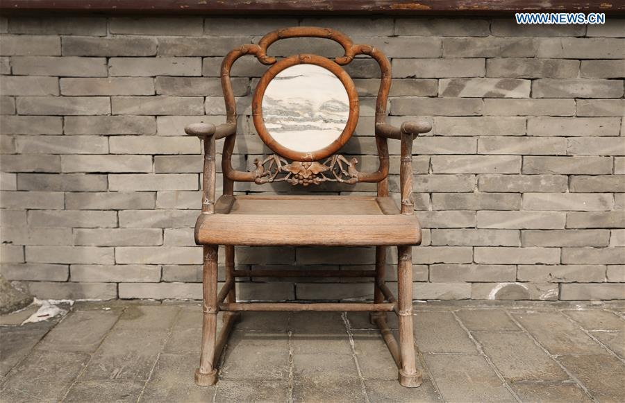Photo taken on April 18, 2019 shows a chair at the Encho-en garden in Tottori, Japan. Covering an area of about 10,000 square meters, Encho-en is one of the biggest full-scaled Chinese-style garden in Japan. It was built in 1995 to show the friendship between Tottori and north China\'s Hebei Province. The designing and materials procurement and processing took place in China. The main building was shop-assembled in China before the final assembly in Japan. All these steps were supervised by Chinese engineers. (Xinhua/Du Xiaoyi)