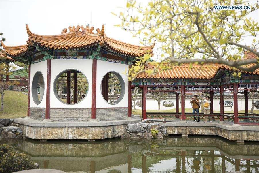 Tourists visit the Encho-en garden in Tottori, Japan, April 18, 2019. Covering an area of about 10,000 square meters, Encho-en is one of the biggest full-scaled Chinese-style garden in Japan. It was built in 1995 to show the friendship between Tottori and north China\'s Hebei Province. The designing and materials procurement and processing took place in China. The main building was shop-assembled in China before the final assembly in Japan. All these steps were supervised by Chinese engineers. (Xinhua/Du Xiaoyi)