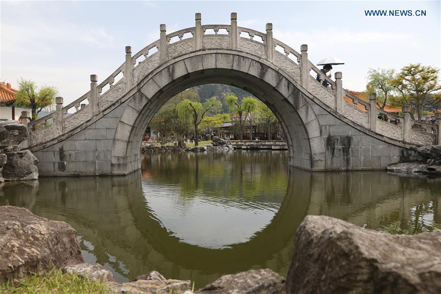 A tourist visits the Encho-en garden in Tottori, Japan, April 18, 2019. Covering an area of about 10,000 square meters, Encho-en is one of the biggest full-scaled Chinese-style garden in Japan. It was built in 1995 to show the friendship between Tottori and north China\'s Hebei Province. The designing and materials procurement and processing took place in China. The main building was shop-assembled in China before the final assembly in Japan. All these steps were supervised by Chinese engineers. (Xinhua/Du Xiaoyi)