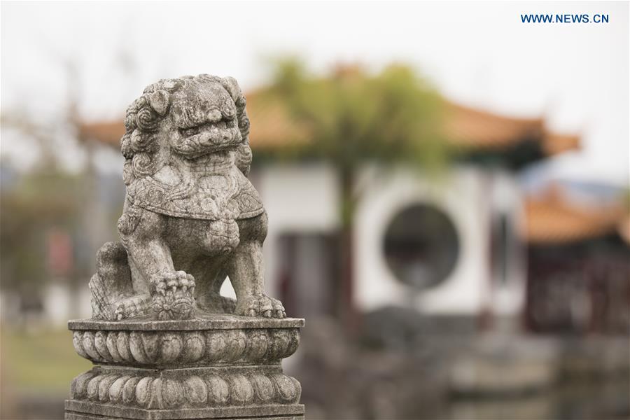 Photo taken on April 18, 2019 shows a stone lion at the Encho-en garden in Tottori, Japan. Covering an area of about 10,000 square meters, Encho-en is one of the biggest full-scaled Chinese-style garden in Japan. It was built in 1995 to show the friendship between Tottori and north China\'s Hebei Province. The designing and materials procurement and processing took place in China. The main building was shop-assembled in China before the final assembly in Japan. All these steps were supervised by Chinese engineers. (Xinhua/Du Xiaoyi)
