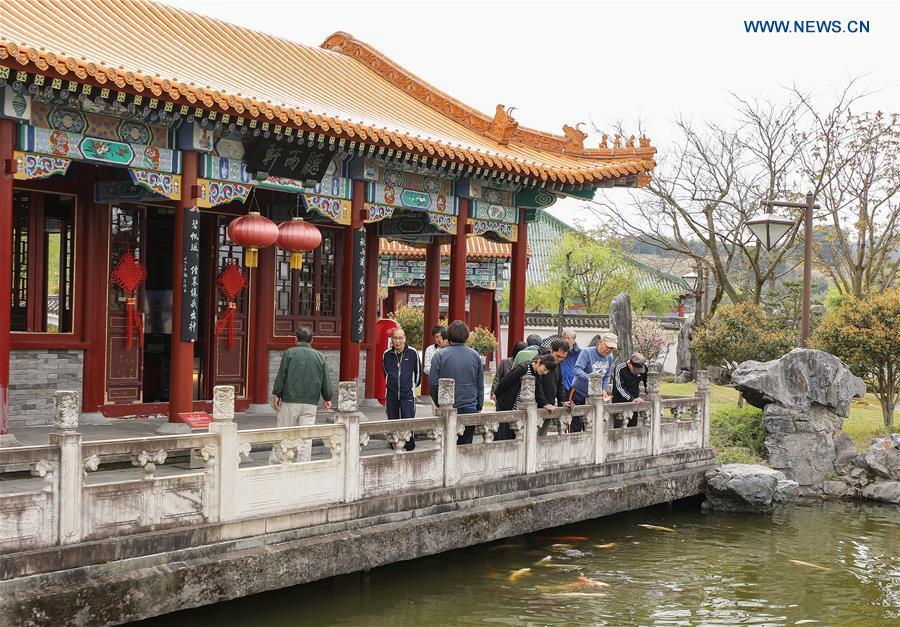 Tourists visit the Encho-en garden in Tottori, Japan, April 18, 2019. Covering an area of about 10,000 square meters, Encho-en is one of the biggest full-scaled Chinese-style garden in Japan. It was built in 1995 to show the friendship between Tottori and north China\'s Hebei Province. The designing and materials procurement and processing took place in China. The main building was shop-assembled in China before the final assembly in Japan. All these steps were supervised by Chinese engineers. (Xinhua/Du Xiaoyi)