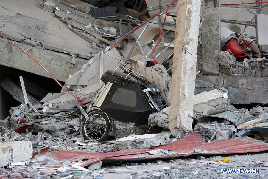 A tricycle is seen under a collapsed building in Pampanga Province, the Philippines, April 23, 2019. The death toll from the 6.1-magnitude earthquake that struck the Philippines\' main Luzon Island rose to nine, local officials said on Tuesday. (Xinhua/Rouelle Umali)