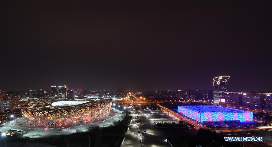 Photo taken on April 10, 2019 shows the night view of the National Stadium (L), also known as the Bird\'s Nest, and the National Aquatics Center, or the Water Cube, in Beijing, capital of China. The second Belt and Road Forum for International Cooperation is to be held on April 25-27 in Beijing. (Xinhua/Chen Yehua)