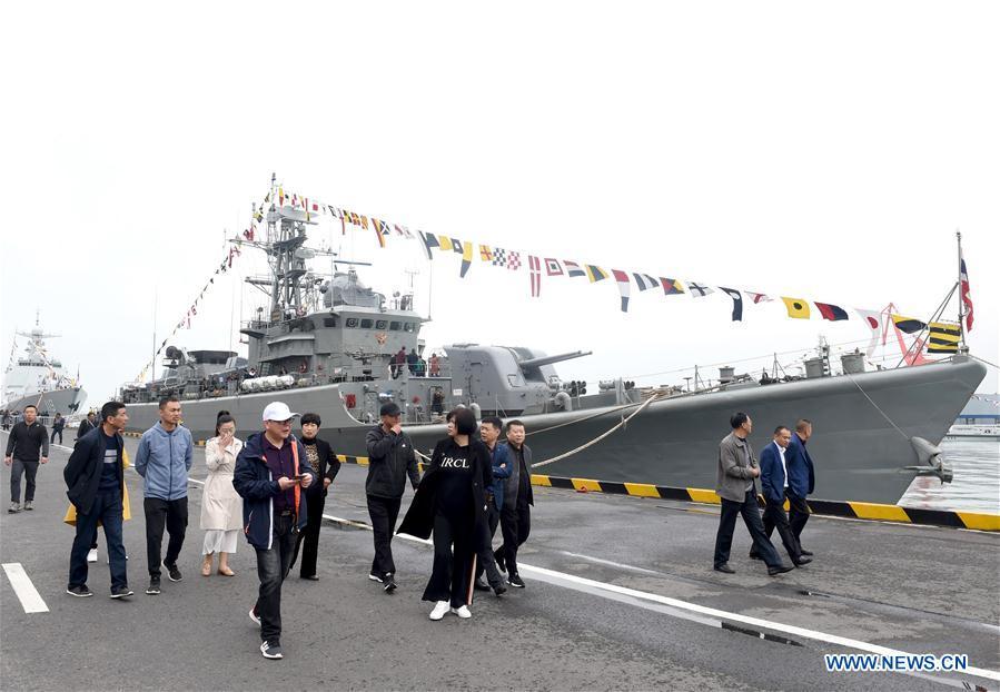 Visitors are seen during a warship open day event in Qingdao, east China\'s Shandong Province, April 24, 2019. A warship open day event was held on Wednesday in Qingdao, as part the multinational naval events marking the 70th founding anniversary of PLA Navy. (Xinhua/Ma Jing)
