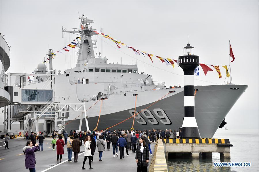 Visitors view the landing vessel Jinggangshan of the Chinese People\'s Liberation Army (PLA) Navy during a warship open day event in Qingdao, east China\'s Shandong Province, April 24, 2019. A warship open day event was held on Wednesday in Qingdao, as part the multinational naval events marking the 70th founding anniversary of PLA Navy. (Xinhua/Guo Xulei)