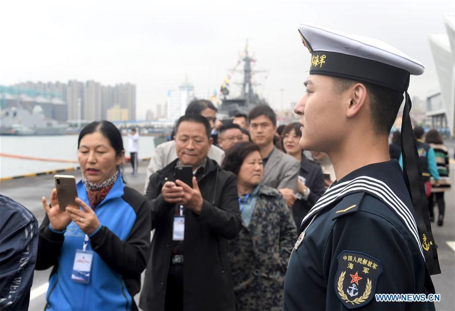 Visitors prepare to board guided-missile destroyer Guiyang of the Chinese People\'s Liberation Army (PLA) Navy during a warship open day event in Qingdao, east China\'s Shandong Province, April 24, 2019. A warship open day event was held on Wednesday in Qingdao, as part the multinational naval events marking the 70th founding anniversary of PLA Navy. (Xinhua/Ma Jing)