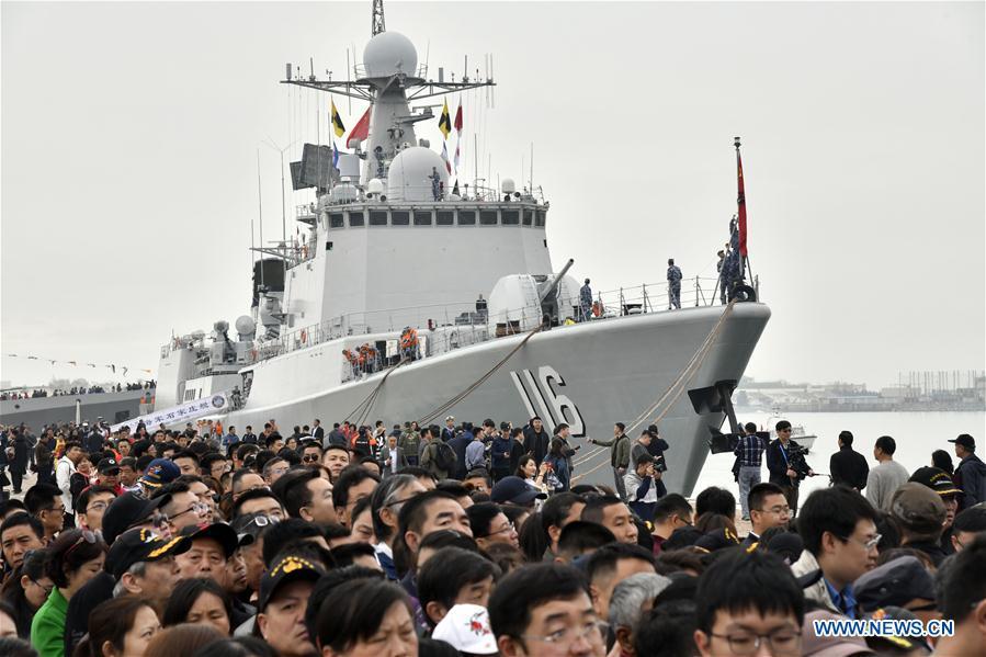 Visitors are seen during a warship open day event in Qingdao, east China\'s Shandong Province, April 24, 2019. A warship open day event was held on Wednesday in Qingdao, as part the multinational naval events marking the 70th founding anniversary of PLA Navy. (Xinhua/Guo Xulei)