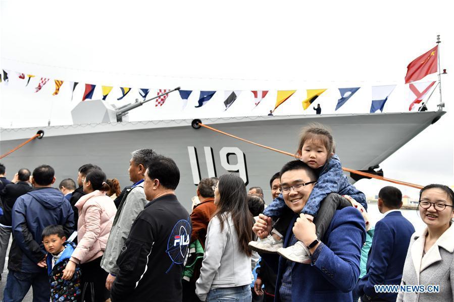Visitors view the guided-missile destroyer Guiyang of the Chinese People\'s Liberation Army (PLA) Navy during a warship open day event in Qingdao, east China\'s Shandong Province, April 24, 2019. A warship open day event was held on Wednesday in Qingdao, as part the multinational naval events marking the 70th founding anniversary of PLA Navy. (Xinhua/Guo Xulei)