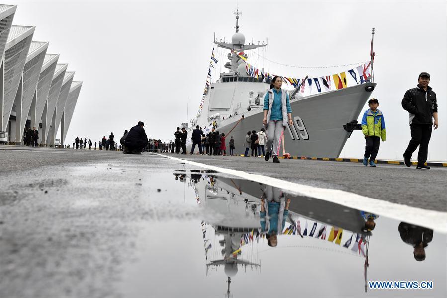 Visitors view the guided-missile destroyer Guiyang of the Chinese People\'s Liberation Army (PLA) Navy during a warship open day event in Qingdao, east China\'s Shandong Province, April 24, 2019. A warship open day event was held on Wednesday in Qingdao, as part the multinational naval events marking the 70th founding anniversary of PLA Navy. (Xinhua/Qian Yi)