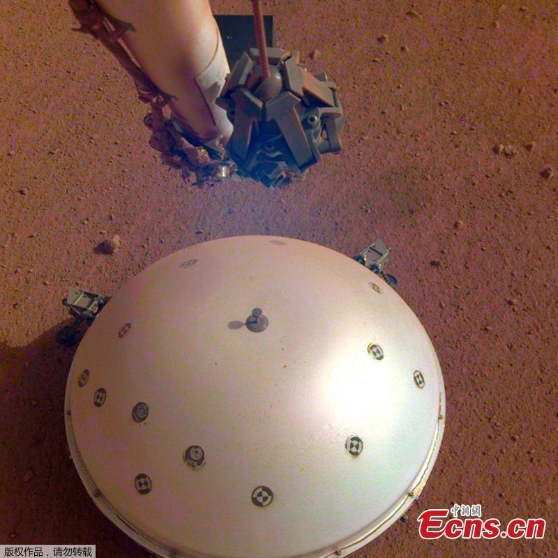 This image, taken March 19, 2019 by a camera on NASA’s Mars InSight lander, shows the rover\'s domed Wind and Thermal Shield, which covers its seismometer, the Seismic Experiment for Interior Structure, and the Martian surface in the background. (Photo/NASA)

NASA\'s robotic probe InSight has detected and measured what scientists believe was a \
