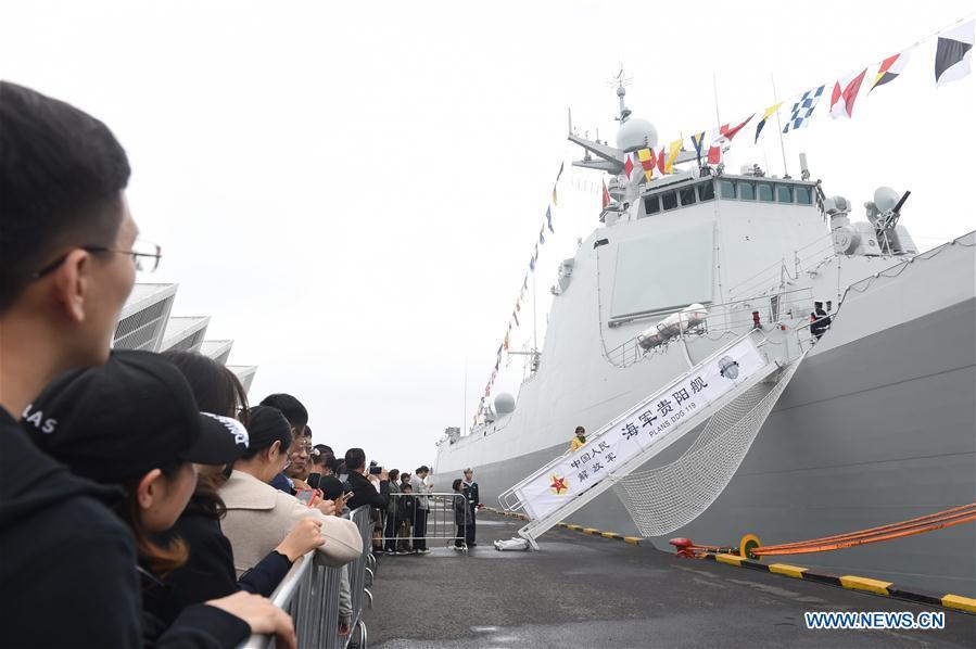 Visitors prepare to board on the guided-missile destroyer Guiyang of the Chinese People\'s Liberation Army (PLA) Navy during a warship open day event in Qingdao, east China\'s Shandong Province, April 24, 2019. A warship open day event was held on Wednesday in Qingdao, as part the multinational naval events marking the 70th founding anniversary of PLA Navy. (Xinhua/Luo Xiaoguang)