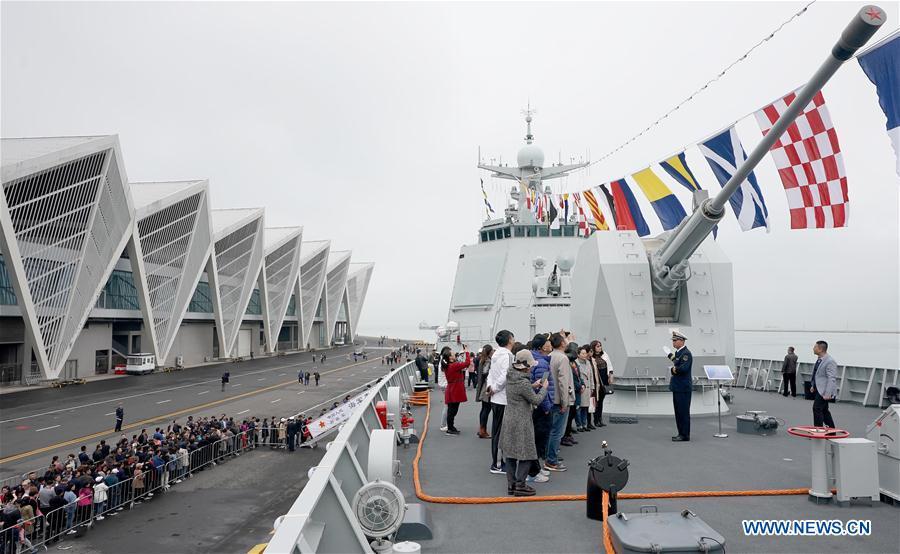 Visitors stand on guided-missile destroyer Guiyang of the Chinese People\'s Liberation Army (PLA) Navy during a warship open day event in Qingdao, east China\'s Shandong Province, April 24, 2019. A warship open day event was held on Wednesday in Qingdao, as part the multinational naval events marking the 70th founding anniversary of PLA Navy. (Xinhua/Wang Yuguo)