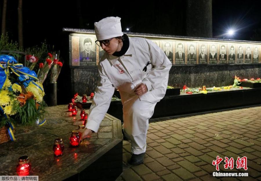 Ukrainians lay flowers at the memorial for \'liquidators\' who died during the cleaning up after the Chernobyl nuclear power plant disaster during a ceremony in Slavutich city, Ukraine, early April 26, 2019. In the early hours of April 26, 1986 the Unit 4 reactor at the Chernobyl power station blew apart. Facing nuclear disaster on unprecedented scale Soviet authorities tried to contain the situation by sending thousands of ill-equipped men into a radioactive maelstrom. The explosion of Unit 4 of the Chernobyl nuclear power plant is still regarded the biggest nuclear accident in the history of nuclear power generation.