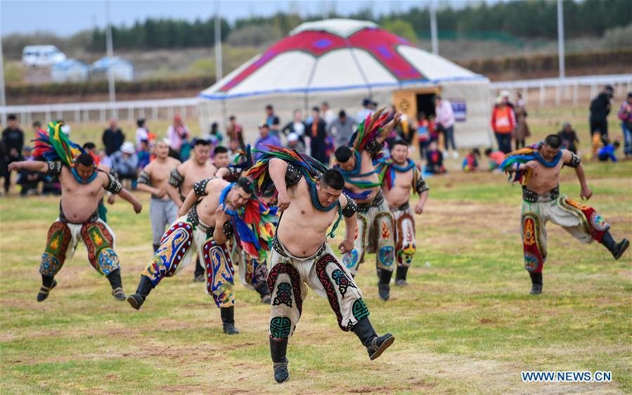 Wrestling competitors are seen at the Genghis Khan Chagan Suluk Nadam Fair in Ejin Horo Banner of Ordos City, north China\'s Inner Mongolia Autonomous Region, April 24, 2019. The two-day fair kicked off on Wednesday, including a variety of traditional activities. (Xinhua/Peng Yuan)