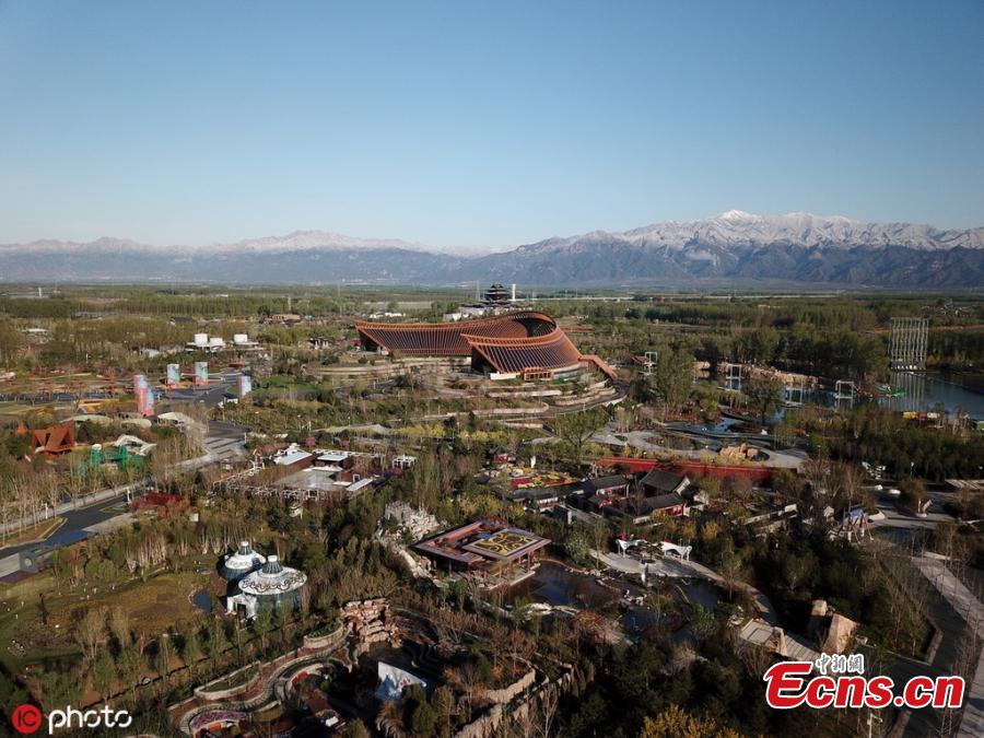 A view of the venue for the Beijing International Horticultural Exhibition against the backdrop of snow-capped mountains in Yanqing district, on the northern outskirts of Beijing, April 25, 2019. All the preparation work, including construction of the site and exhibits, has been completed as the April 29 official opening of the expo draws near, according to the organizer. (Photo/IC)