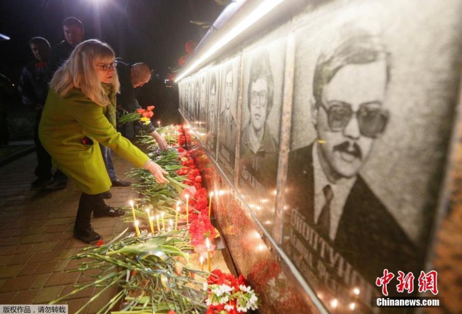 Ukrainians lay flowers at the memorial for \'liquidators\' who died during the cleaning up after the Chernobyl nuclear power plant disaster during a ceremony in Slavutich city, Ukraine, early April 26, 2019. In the early hours of April 26, 1986 the Unit 4 reactor at the Chernobyl power station blew apart. Facing nuclear disaster on unprecedented scale Soviet authorities tried to contain the situation by sending thousands of ill-equipped men into a radioactive maelstrom. The explosion of Unit 4 of the Chernobyl nuclear power plant is still regarded the biggest nuclear accident in the history of nuclear power generation.