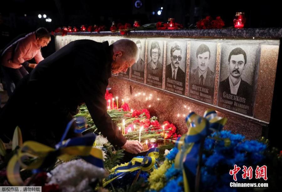 Ukrainians lay flowers at the memorial for \'liquidators\' who died during the cleaning up after the Chernobyl nuclear power plant disaster during a ceremony in Slavutich city, Ukraine, early April 26, 2019. In the early hours of April 26, 1986 the Unit 4 reactor at the Chernobyl power station blew apart. Facing nuclear disaster on unprecedented scale Soviet authorities tried to contain the situation by sending thousands of ill-equipped men into a radioactive maelstrom. The explosion of Unit 4 of the Chernobyl nuclear power plant is still regarded the biggest nuclear accident in the history of nuclear power generation.