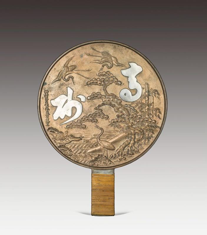 Bronze mirrors bearing intricate carved patterns on the back once played a major role in the daily life of the Chinese and the Japanese. (Photo provided to chinadaily.com.cn)