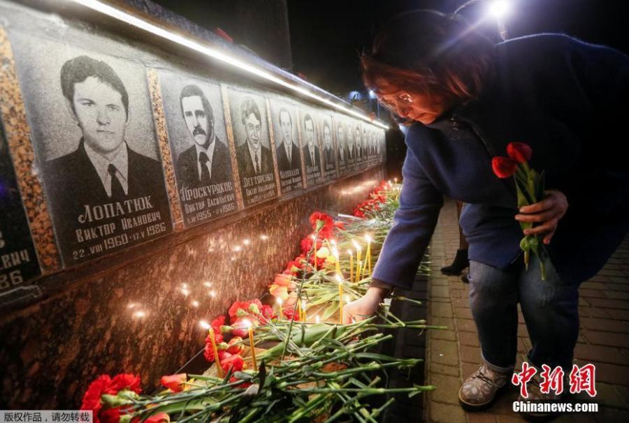 Ukrainians lay flowers at the memorial for \'liquidators\' who died during the cleaning up after the Chernobyl nuclear power plant disaster during a ceremony in Slavutich city, Ukraine, early April 26, 2019. In the early hours of April 26, 1986 the Unit 4 reactor at the Chernobyl power station blew apart. Facing nuclear disaster on unprecedented scale Soviet authorities tried to contain the situation by sending thousands of ill-equipped men into a radioactive maelstrom. The explosion of Unit 4 of the Chernobyl nuclear power plant is still regarded the biggest nuclear accident in the history of nuclear power generation.