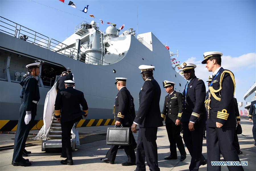 Foreign delegates prepare to visit the landing vessel Jinggangshan of the Chinese People\'s Liberation Army (PLA) Navy in Qingdao, east China\'s Shandong Province, April 25, 2019. Foreign delegations invited to participate in the multinational naval events marking the 70th anniversary of the founding of the Chinese PLA Navy visited Chinese vessels and communicated with Chinese soldiers and officers on Thursday. (Xinhua/Li Ziheng)