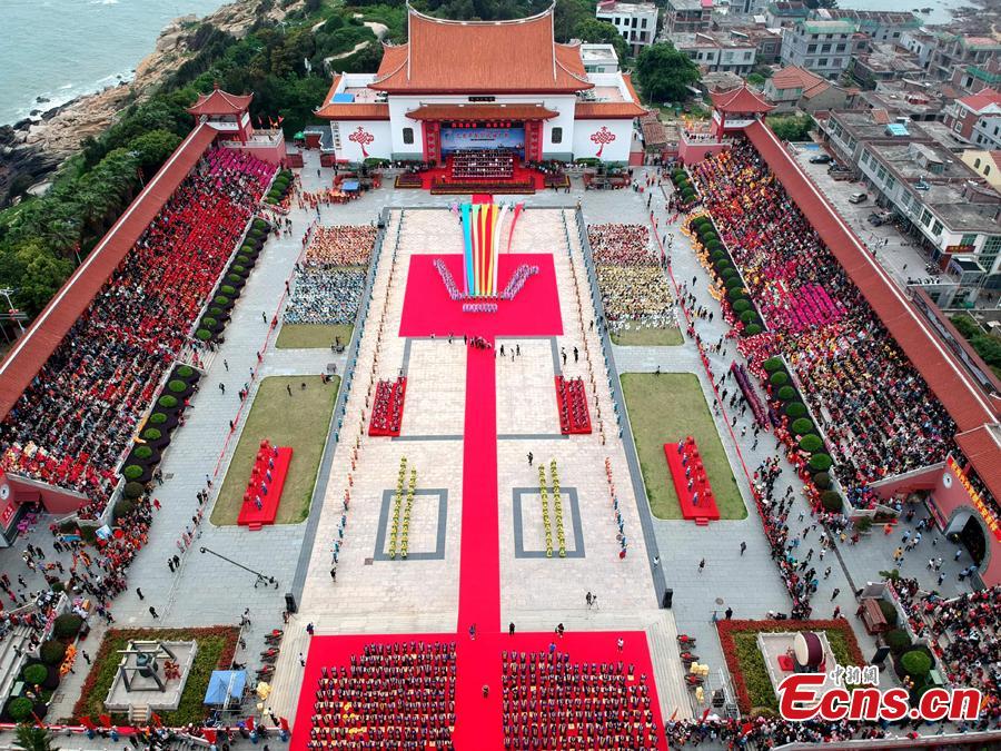 Thousands of people gather for a grand worship ceremony marking the 1,059th birthday of sea goddess Mazu on Meizhou Island in Putian City, East China\'s Fujian Province, April 27, 2019. Mazu is the deified form of Lin Mo, a shaman who lived in the 10th century on Meizhou Island. Revered after her death as a patron of seafarers, including fishermen and sailors, her worship spread throughout China\'s coastal regions and Chinese communities throughout Southeast Asia.  (Photo: China News Service/Lyu Ming)