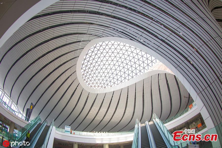 Photo taken on April 26, 2019 shows a view of the inside of the Beijing Daxing International Airport, which will begin operations before the end of September. The new airport sits at the junction of Beijing\'s southern Daxing District and Langfang, a city in Hebei Province. It is expected to handle 45 million passengers annually by 2021 and 72 million by 2025. (Photo/IC)