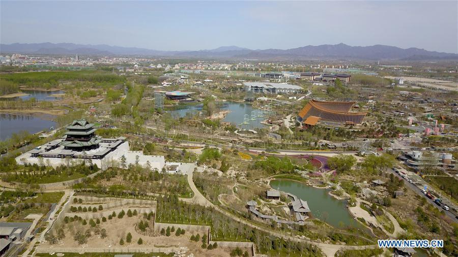 Aerial photo taken on April 18, 2019 shows the site of the International Horticultural Exhibition 2019 Beijing in Yanqing District of Beijing, capital of China. The International Horticultural Exhibition 2019 Beijing, the largest expo of its kind in the world, opened to the public Monday in Yanqing District. Yanqing boasts itself as being home to parts of the Great Wall. It is a summer resort and the agricultural base of Beijing. The upgrading of infrastructure and the acceleration of the horticulture industry because of the expo can further stimulate the development of tourism in Yanqing. (Xinhua/Chen Yehua)